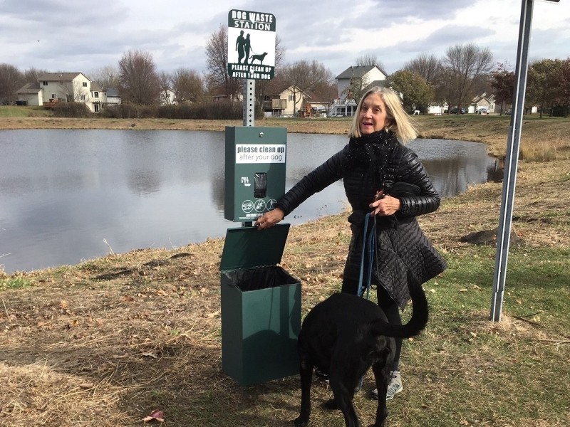 Woman with dog at Pet Waste Station